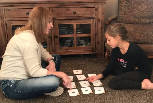 Mom and child "playing cards"